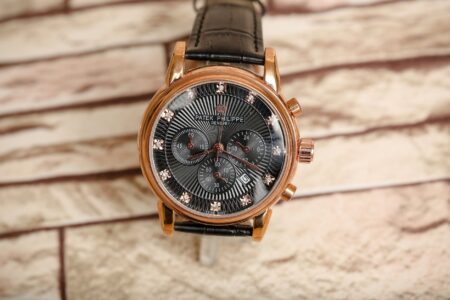copper gold brand watch with black dial and strap